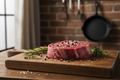 Eye of round steak on a cutting board